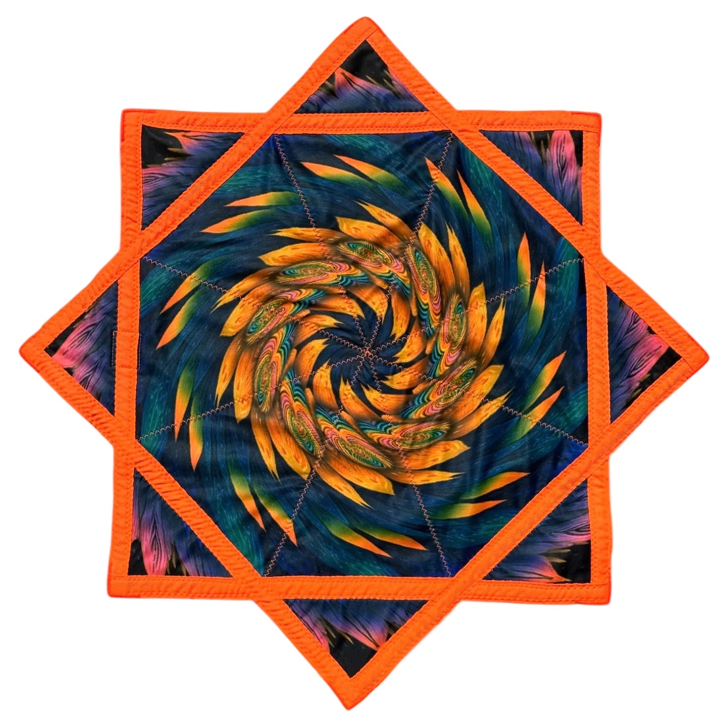 Hexagonal quilt with orange border and colorful spiral design on a white background